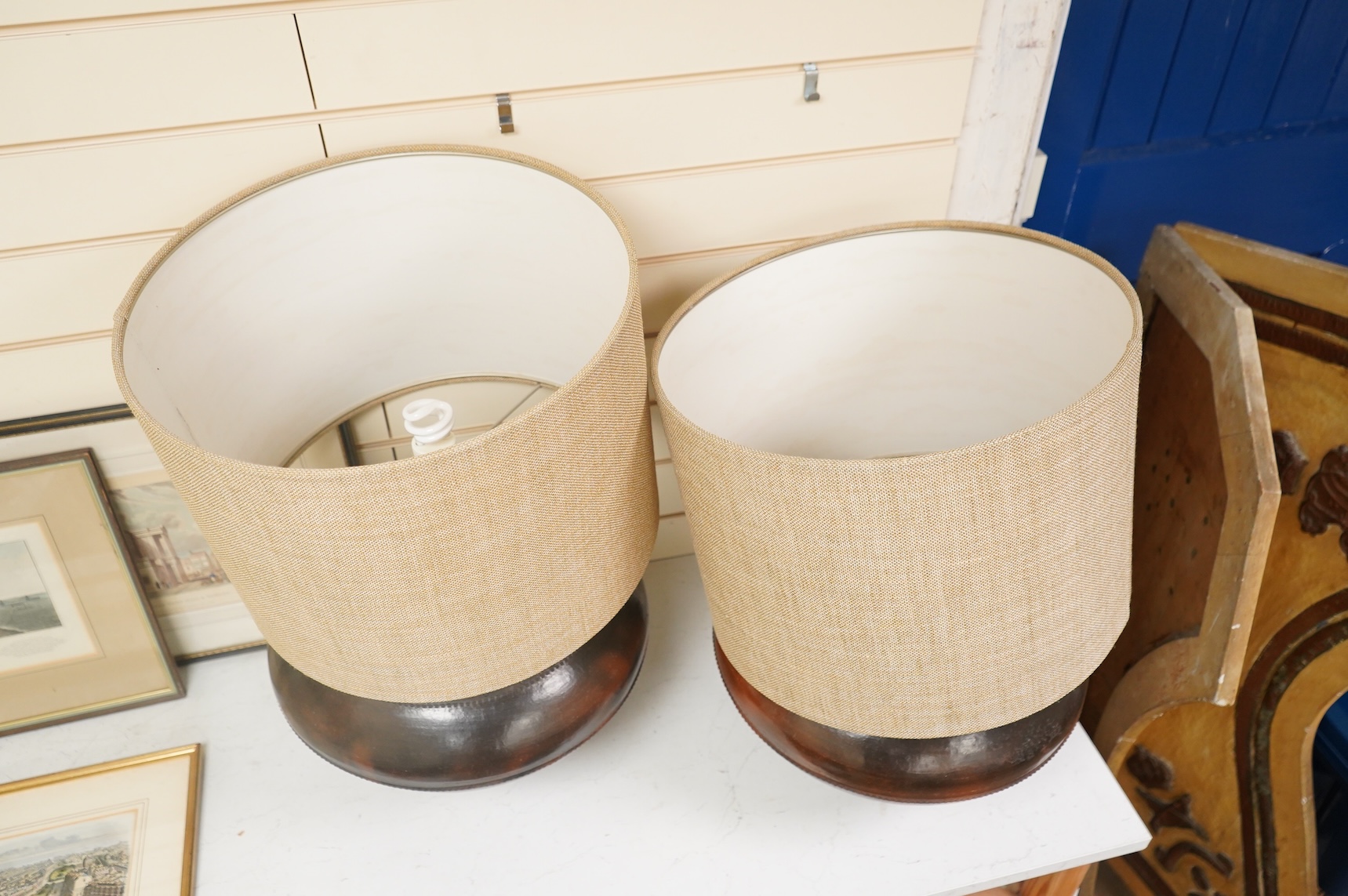 A pair of large brass table lamps and shades, 61cm high